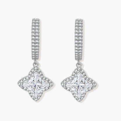 Sterling silver huggie hoops with geometric diamond-shaped moissanite dangles featuring pavé crystal details