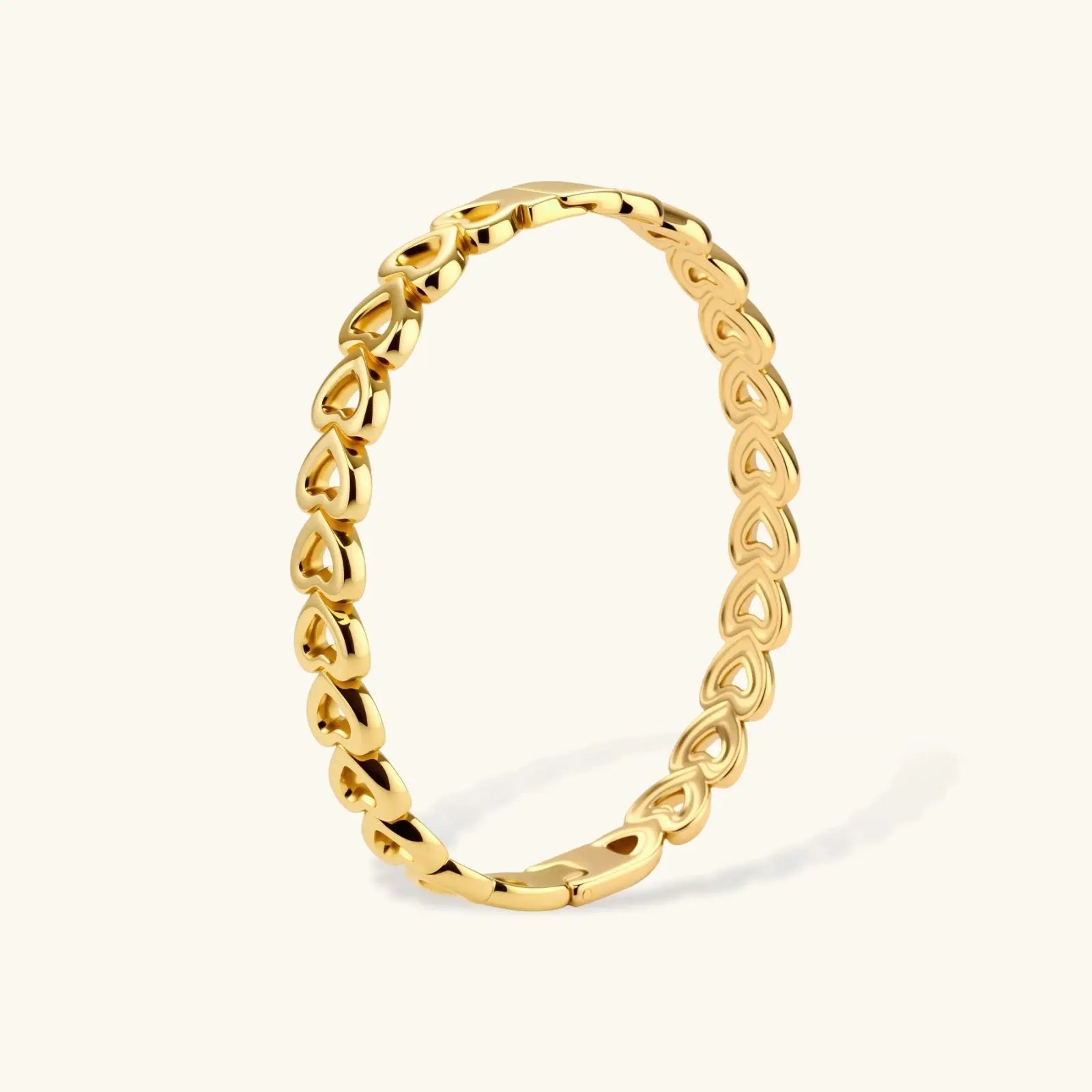 Gold 18K plated stainless steel bangle with continuous open heart links, high-polish finish, on white background.