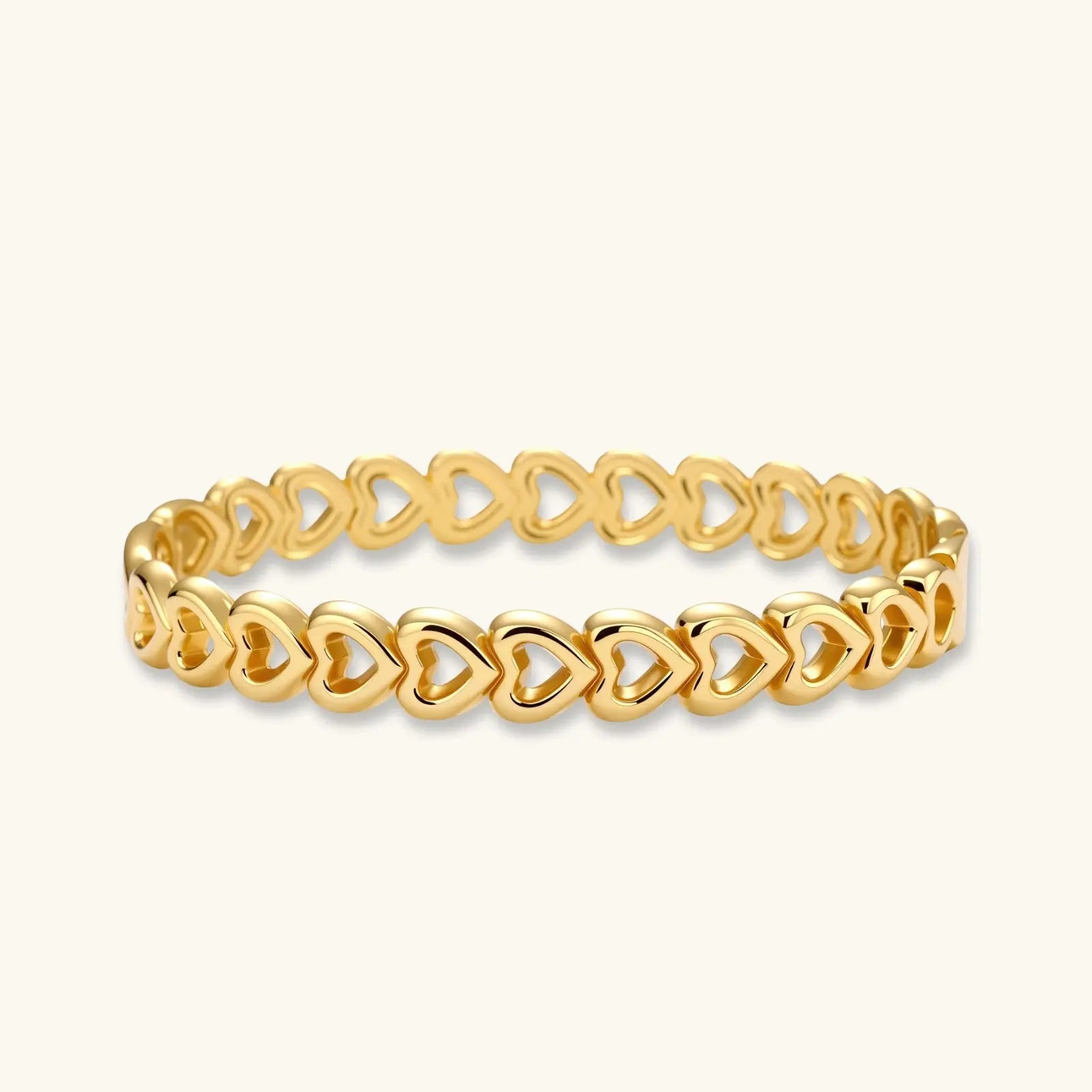 Gold 18K plated stainless steel bangle with continuous open heart links, high-polish finish, on white background.